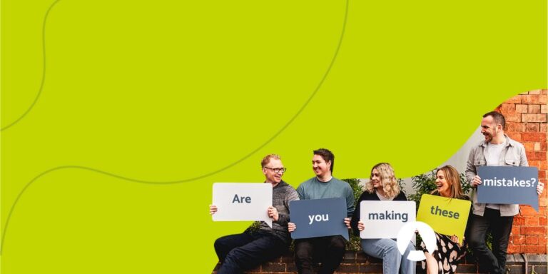 The adventure team holding up boards that say are you making these common website mistakes?
