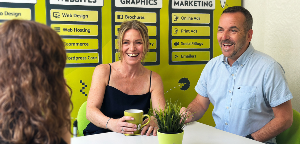 Owners of Adventure Graphics Penny and Warwick sat talking to their team member Caitlin about their 20 years in business.