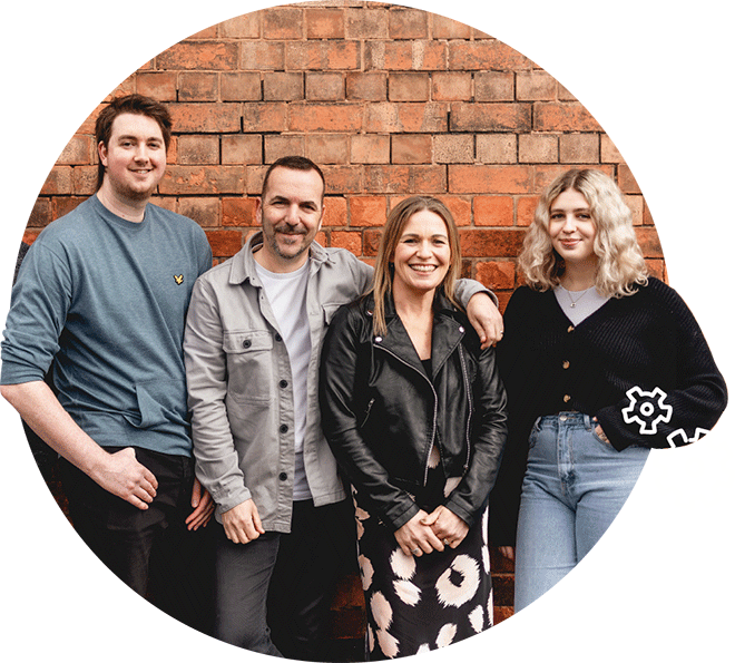 The Adventure Graphics team standing together outside the studio
