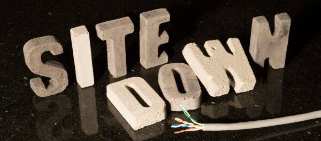Concrete letters spelling 'Site Down' to accompany a blog about why your really wordpress website maintenance and why do plugins on WordPress websites stop working